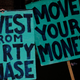 Climate change activists demonstrate outside the offices of JPMorgan Chase Bank in Portland, Ore., on May 7, 2018.